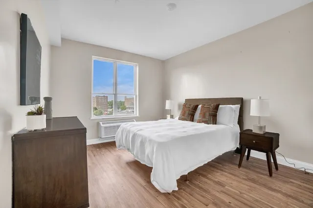 a bedroom with a bed and a table in it