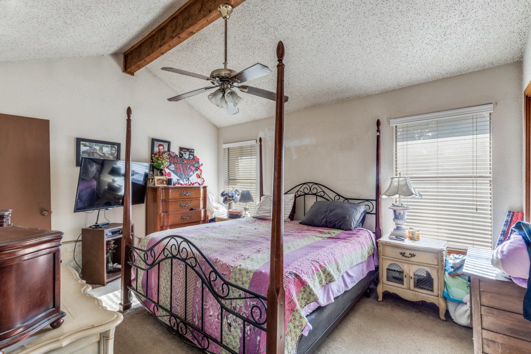 1301 Wayne Drive Round Rock, TX 78664 - Photo 13 of 21 a bedroom with a bed a couch and dresser