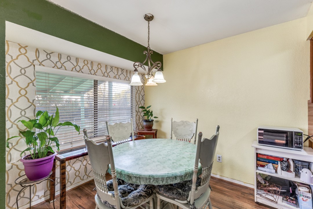 1301 Wayne Drive Round Rock, TX 78664 - Photo 10 of 21 a view of a dining room with furniture and wooden floor