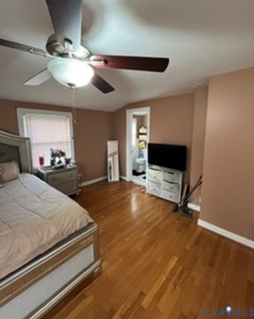 3732 Birdwood Road Richmond, VA 23234 - Photo 12 of 28 a bedroom with a bed and a flat screen tv