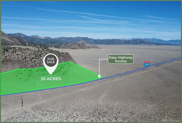 a view of a street with a car park in the back