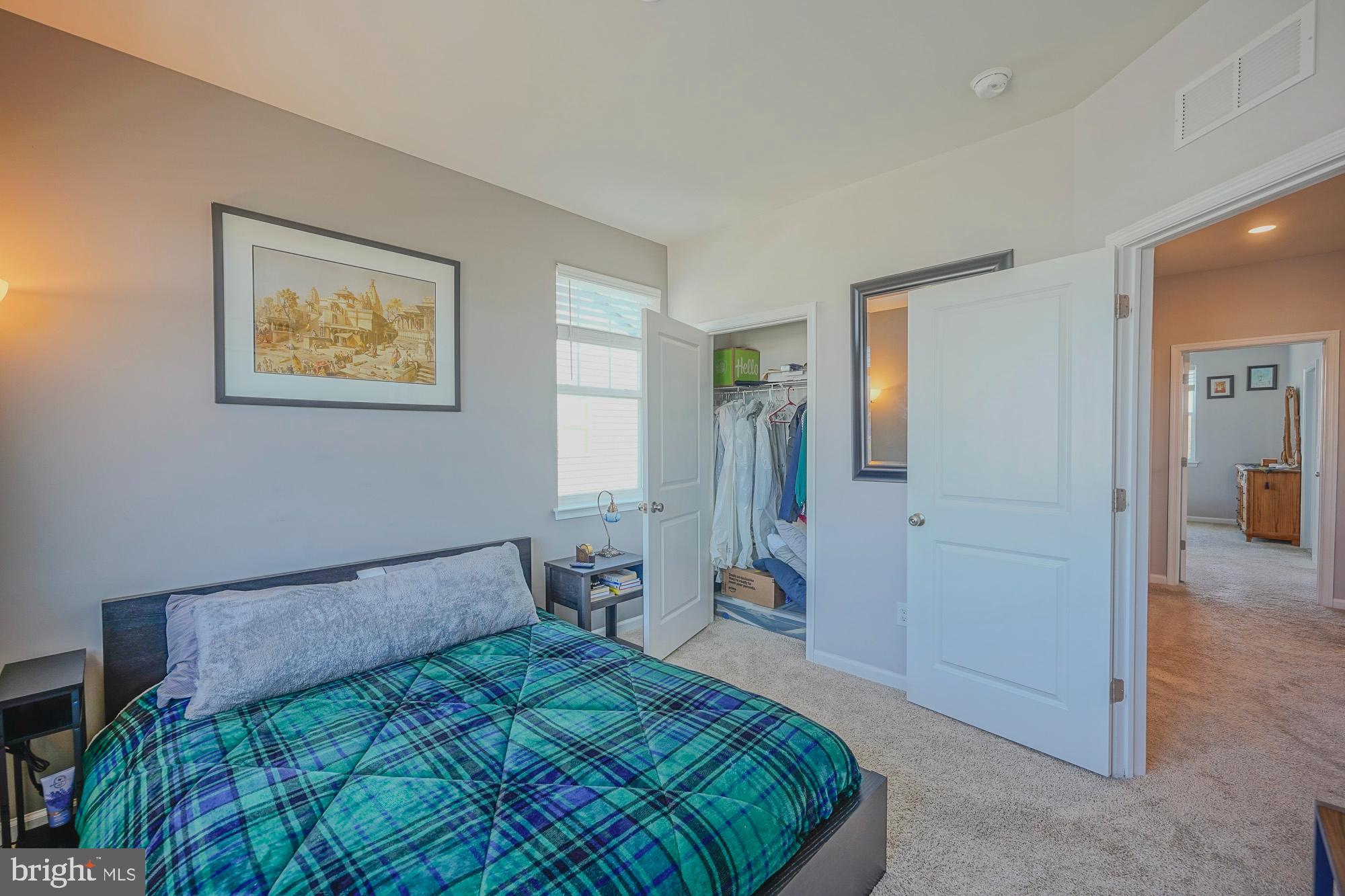 15 Turin Way Mount Laurel, NJ 08054 - Photo 26 of 36 a bedroom with a bed and a painting on the wall