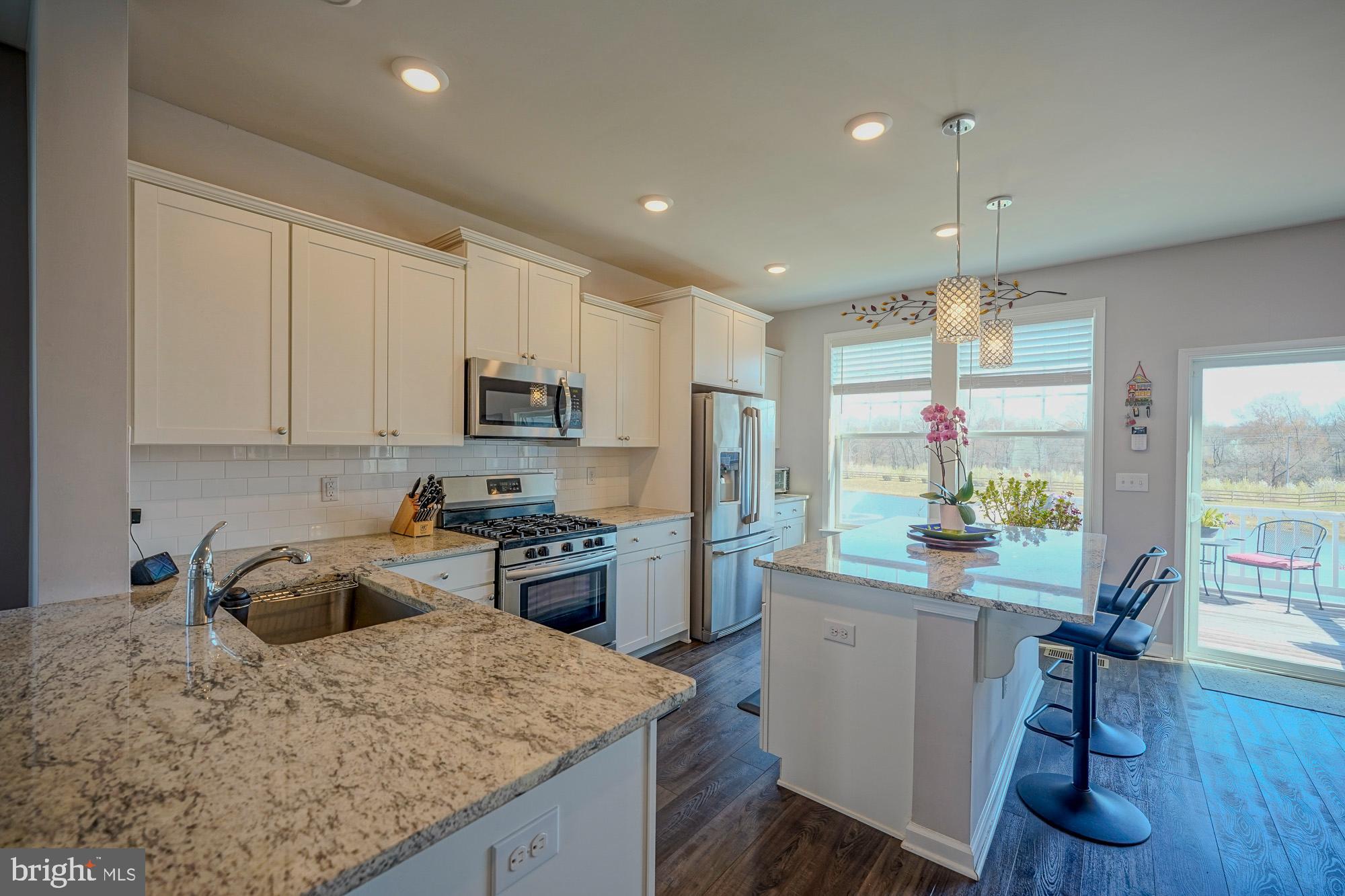 15 Turin Way Mount Laurel, NJ 08054 - Photo 5 of 36 a kitchen with a sink a stove a refrigerator cabinets and wooden floor