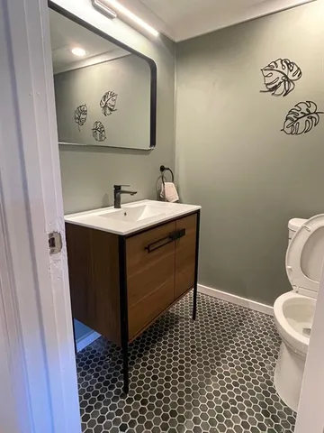 a bathroom with a sink and a toilet