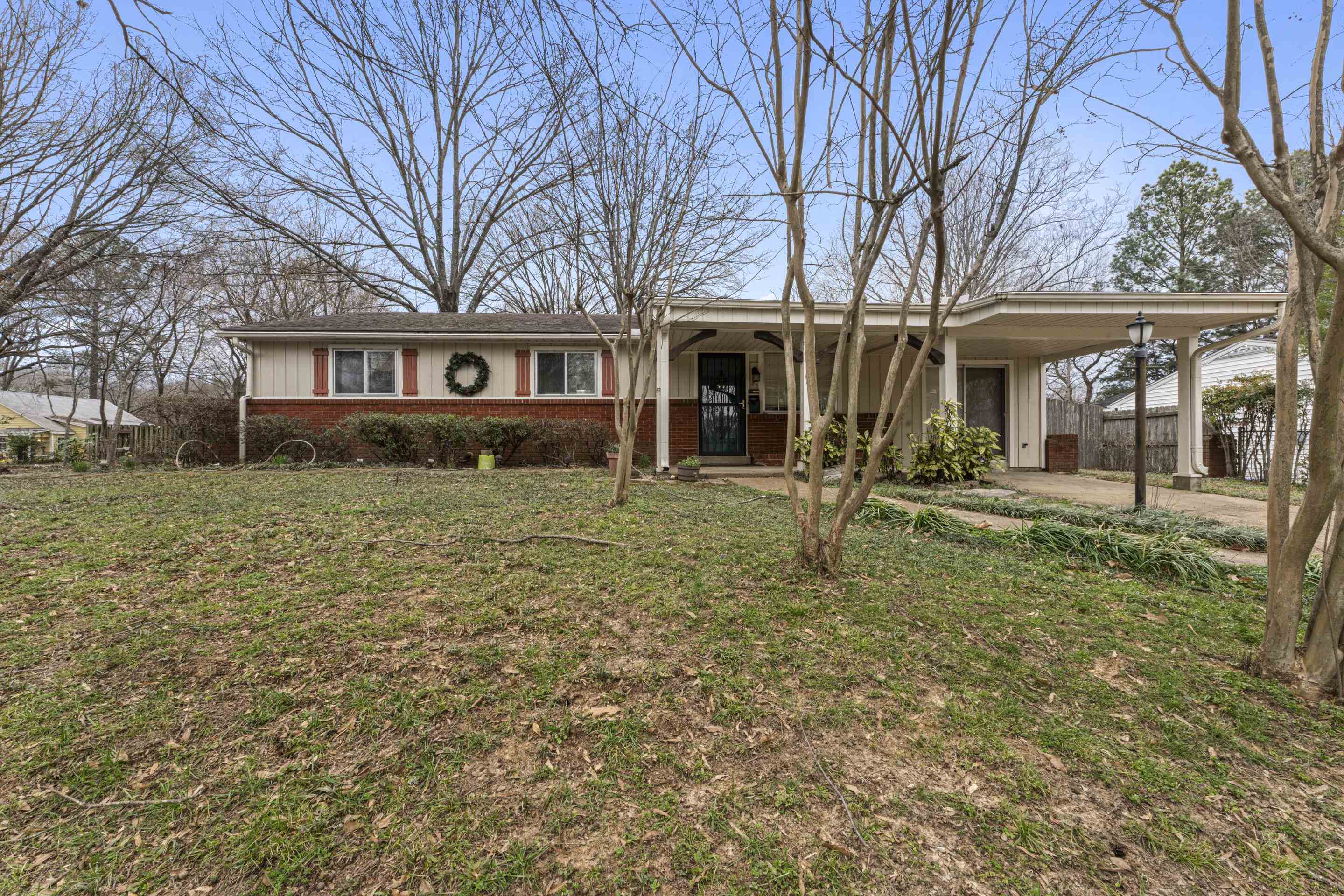 319 Homeville Road Collierville, TN 38017 - Photo 1 of 21 a house that has a tree in front of it