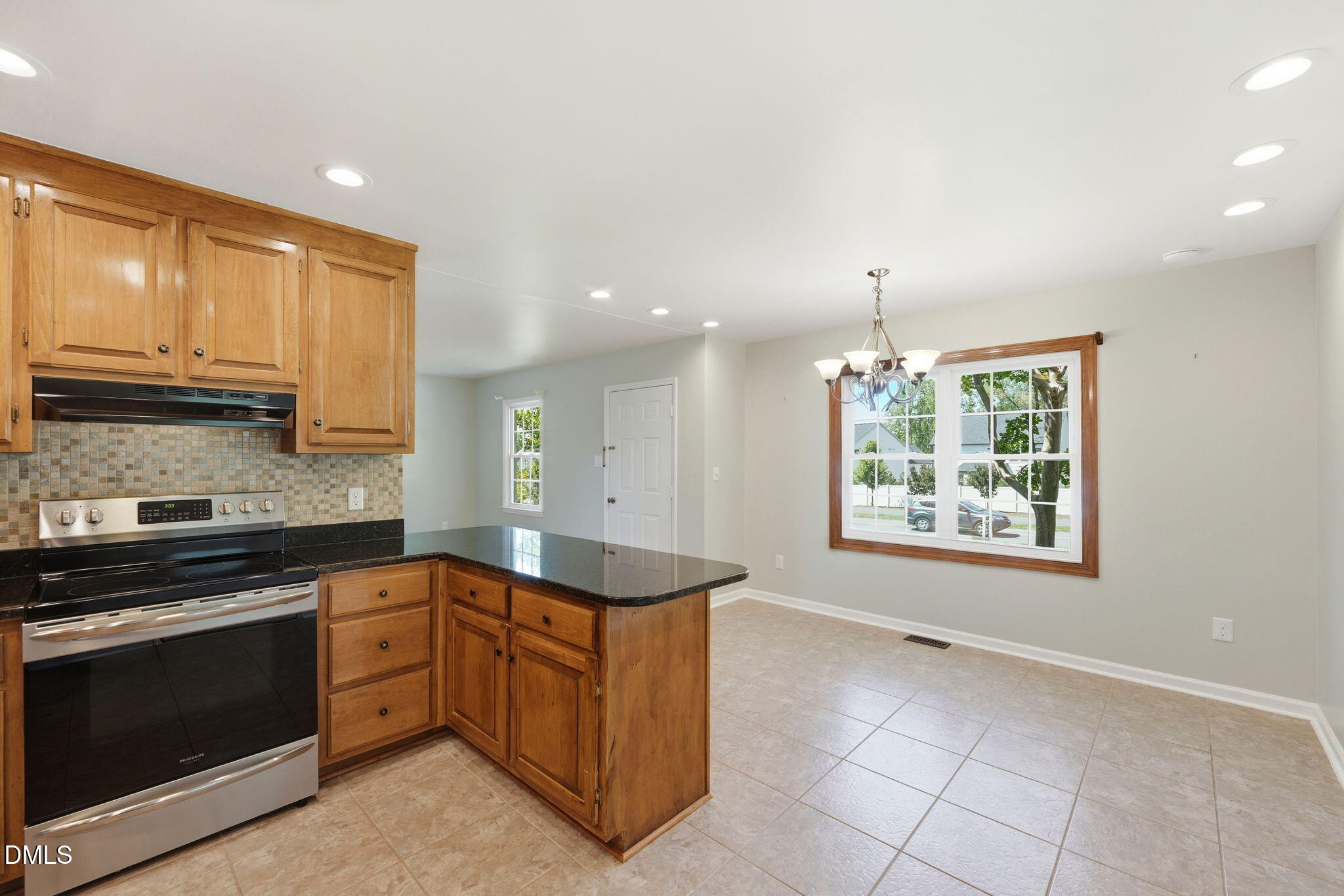 812 East Stagecoach Road Mebane, NC 27302 - Photo 11 of 25 a kitchen with stainless steel appliances granite countertop a stove a sink and a microwave