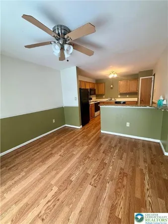 a view of a kitchen with a sink and cabinets