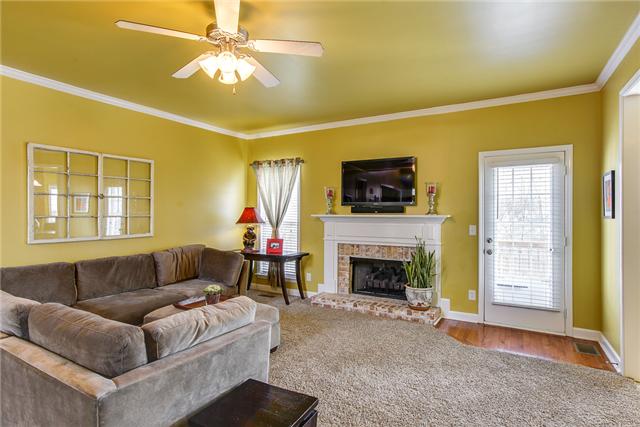 3049 Romain Trail Spring Hill, TN 37174 - Photo 5 of 20 Formal Dining Room with Tray Ceiling and Fireplace. Seller added the Hardwood Entrance Area to the Deck. Also Hardwood floor was installed in Hallway.