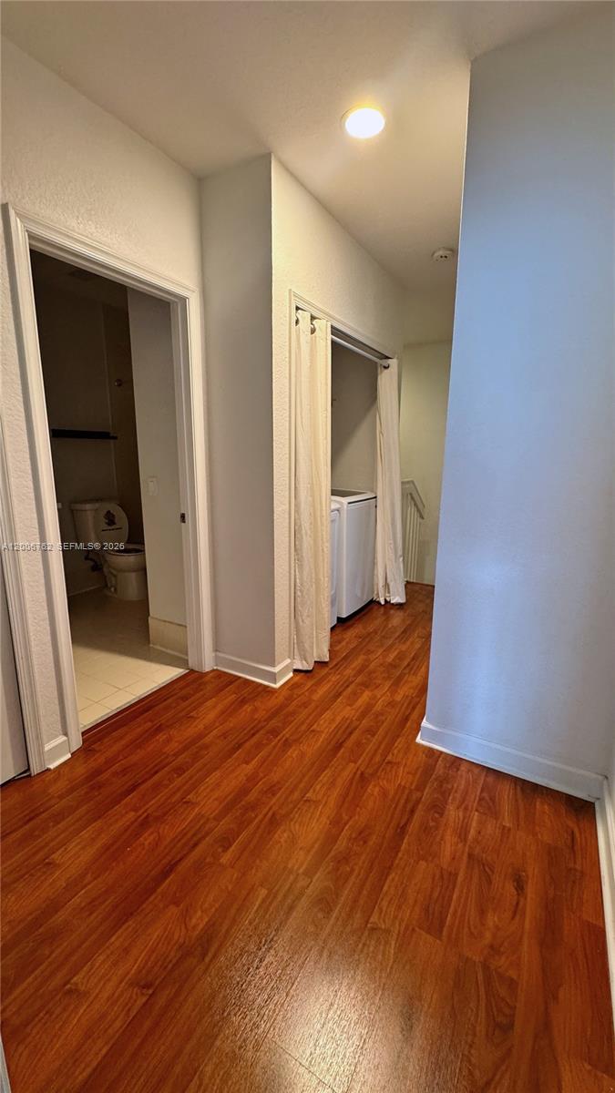 15810 Southwest 40th Street, Unit 57 Miramar, FL 33027 - Photo 13 of 20 a view of empty room with wooden floor