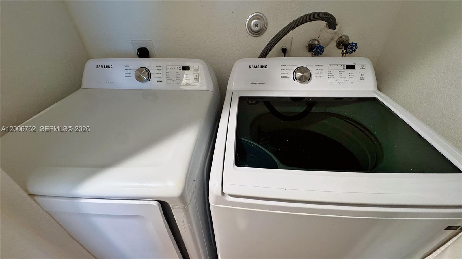 15810 Southwest 40th Street, Unit 57 Miramar, FL 33027 - Photo 17 of 20 a utility room with dryer and washer