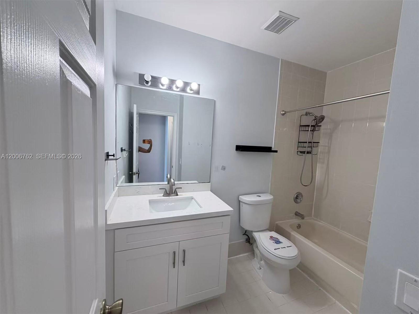 15810 Southwest 40th Street, Unit 57 Miramar, FL 33027 - Photo 20 of 20 a bathroom with a sink a toilet and shower