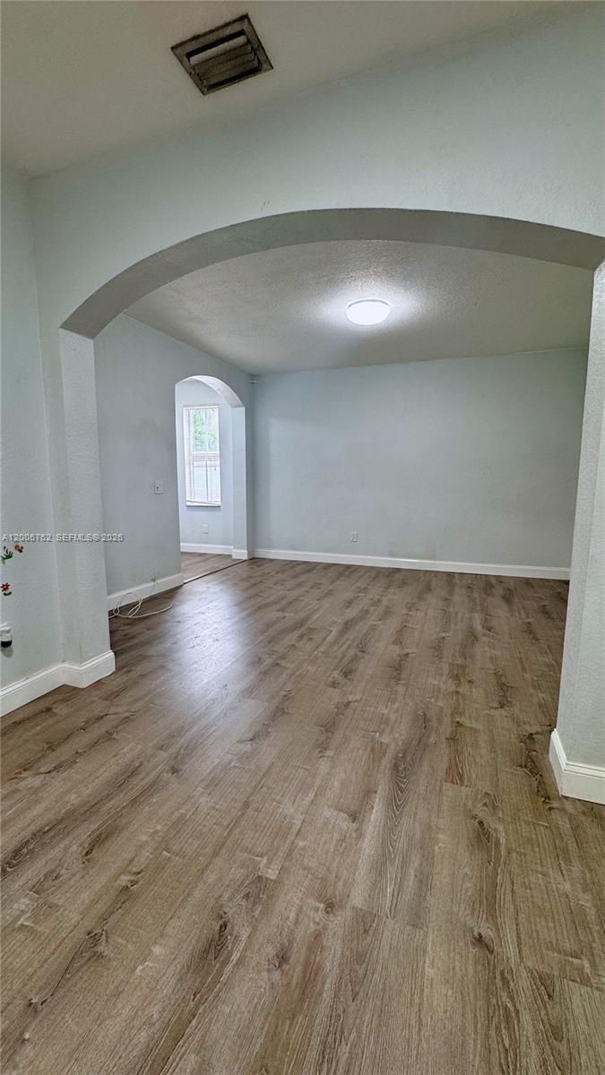 15810 Southwest 40th Street, Unit 57 Miramar, FL 33027 - Photo 5 of 20 a view of an empty room and window