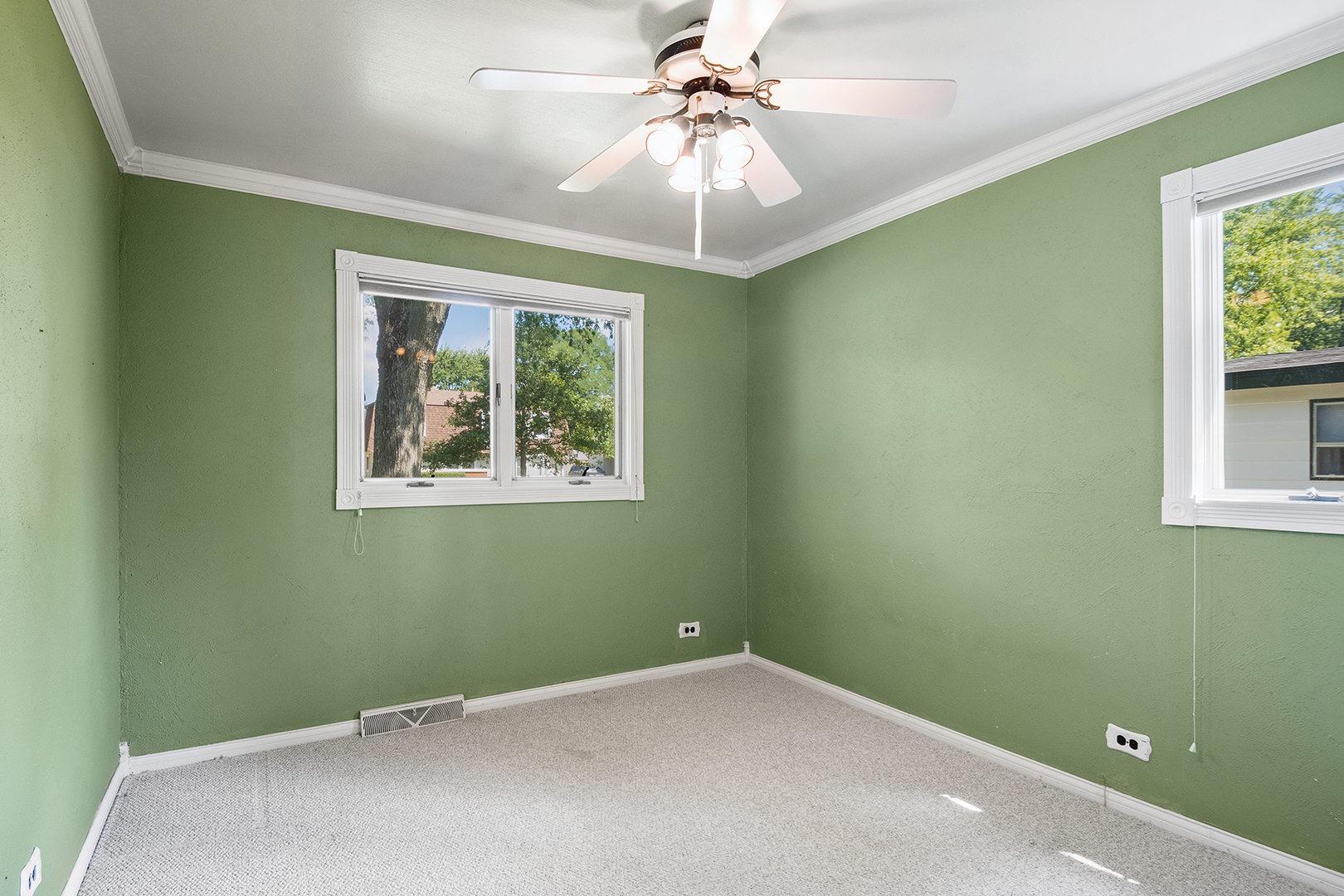 2305 Fulle Street Rolling Meadows, IL 60008 - Photo 12 of 15 an empty room with windows and fan