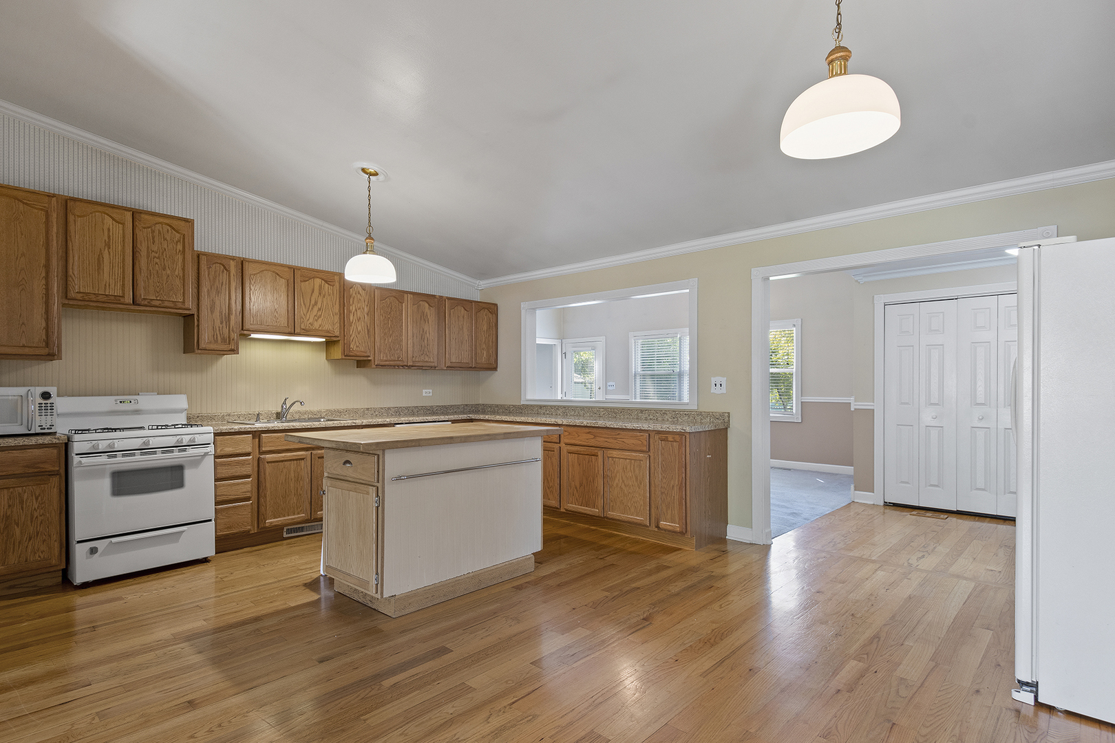 2305 Fulle Street Rolling Meadows, IL 60008 - Photo 3 of 15 a kitchen with stainless steel appliances granite countertop a stove cabinets and wooden floor