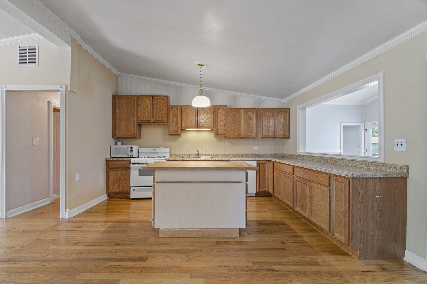 2305 Fulle Street Rolling Meadows, IL 60008 - Photo 4 of 15 a kitchen with stainless steel appliances granite countertop a sink cabinets and wooden floor