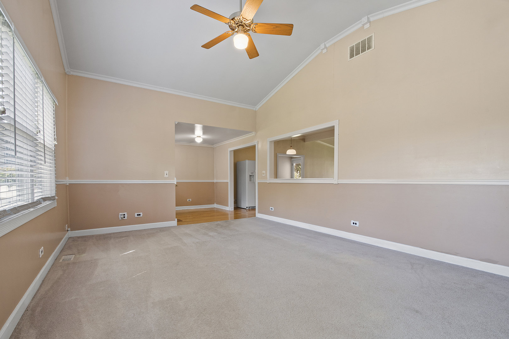 2305 Fulle Street Rolling Meadows, IL 60008 - Photo 7 of 15 an empty room with windows and fan