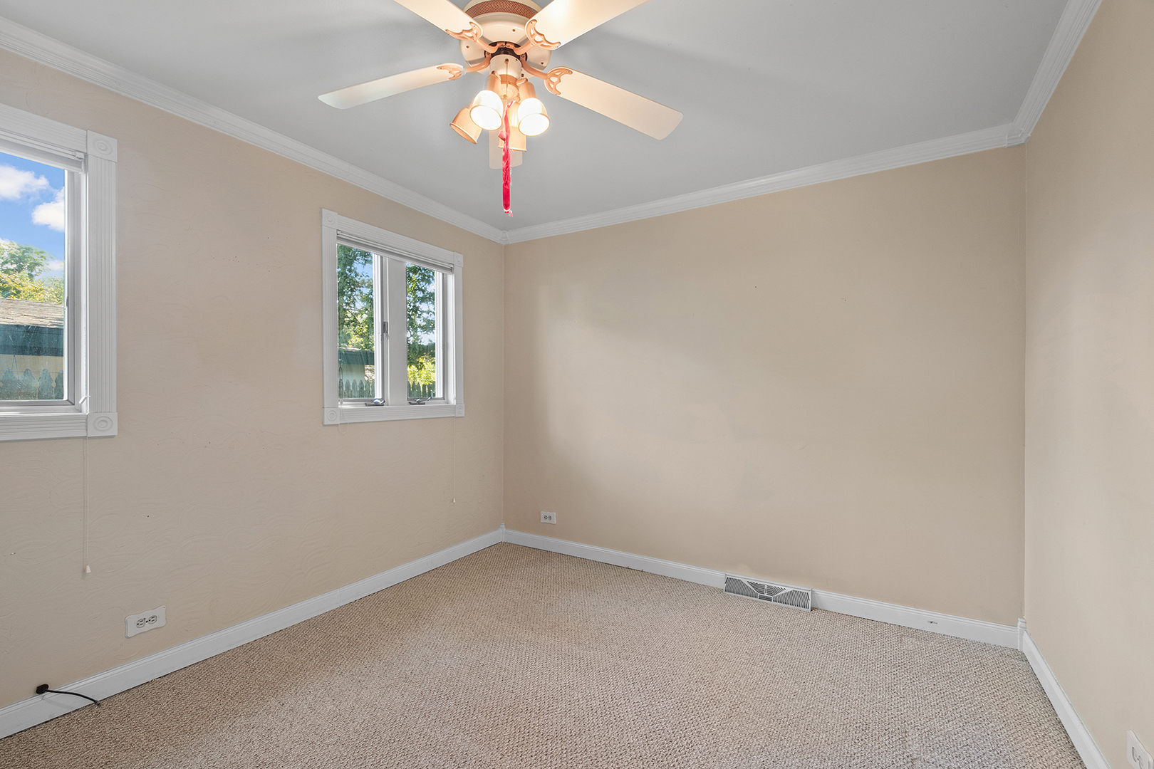 2305 Fulle Street Rolling Meadows, IL 60008 - Photo 10 of 15 an empty room with a window and a fan