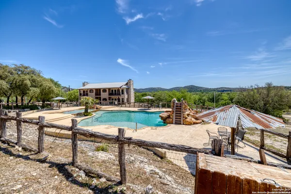 a view of a patio with swimming pool