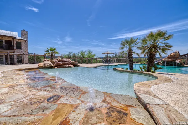 a view of swimming pool outdoor seating