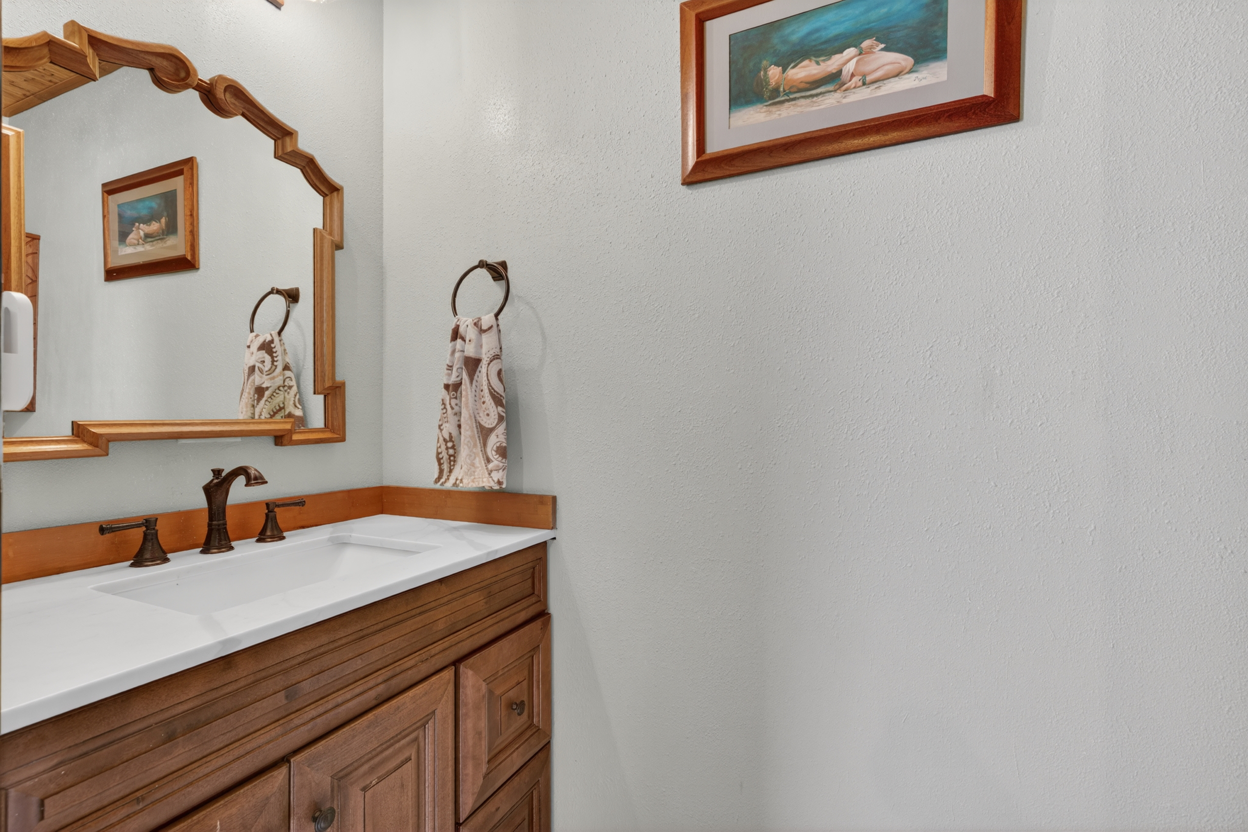 87-299 Kaohe Road Captain Cook, HI 96704 - Photo 14 of 30 a bathroom with a sink and a mirror