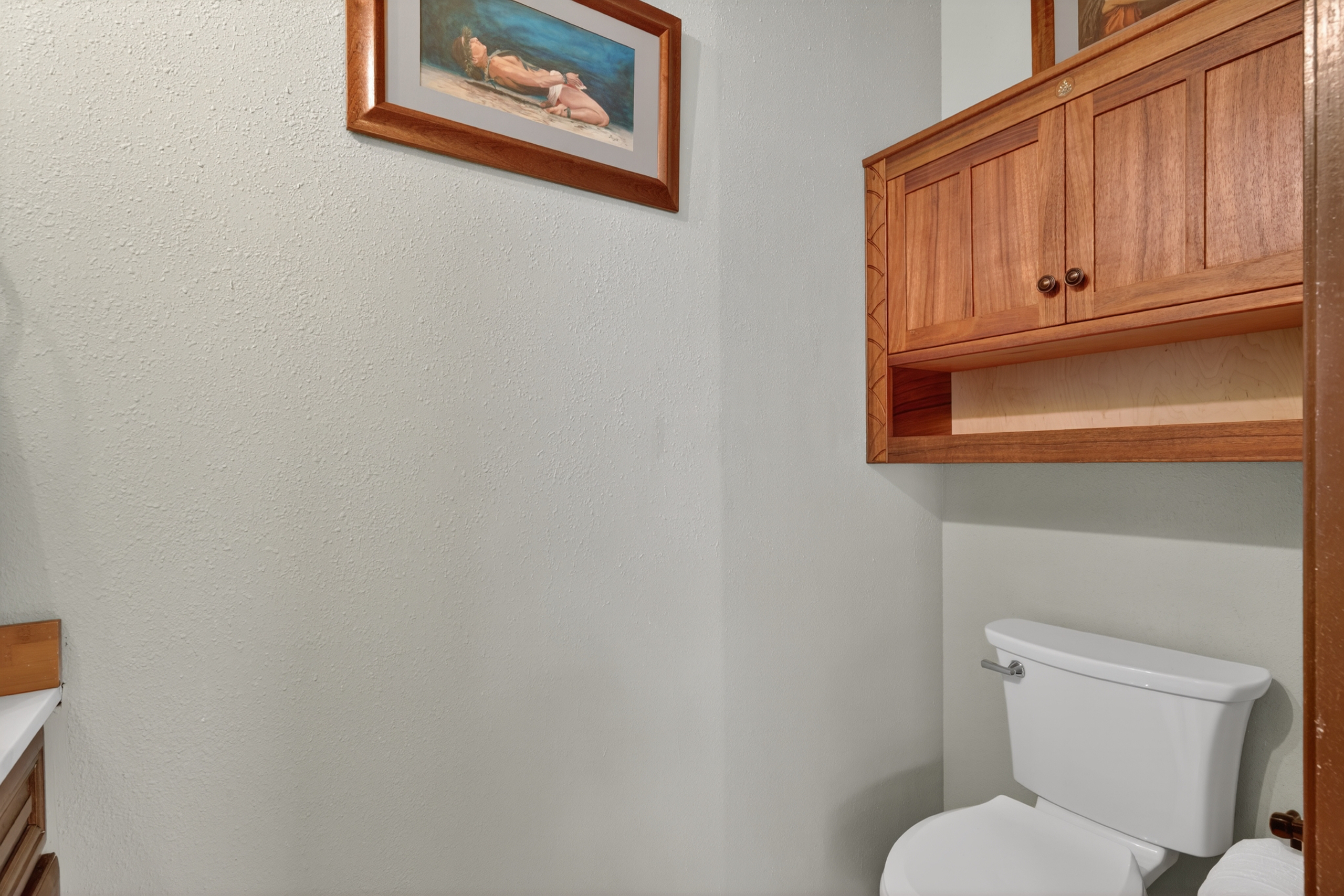 87-299 Kaohe Road Captain Cook, HI 96704 - Photo 15 of 30 a white toilet sitting next to a window