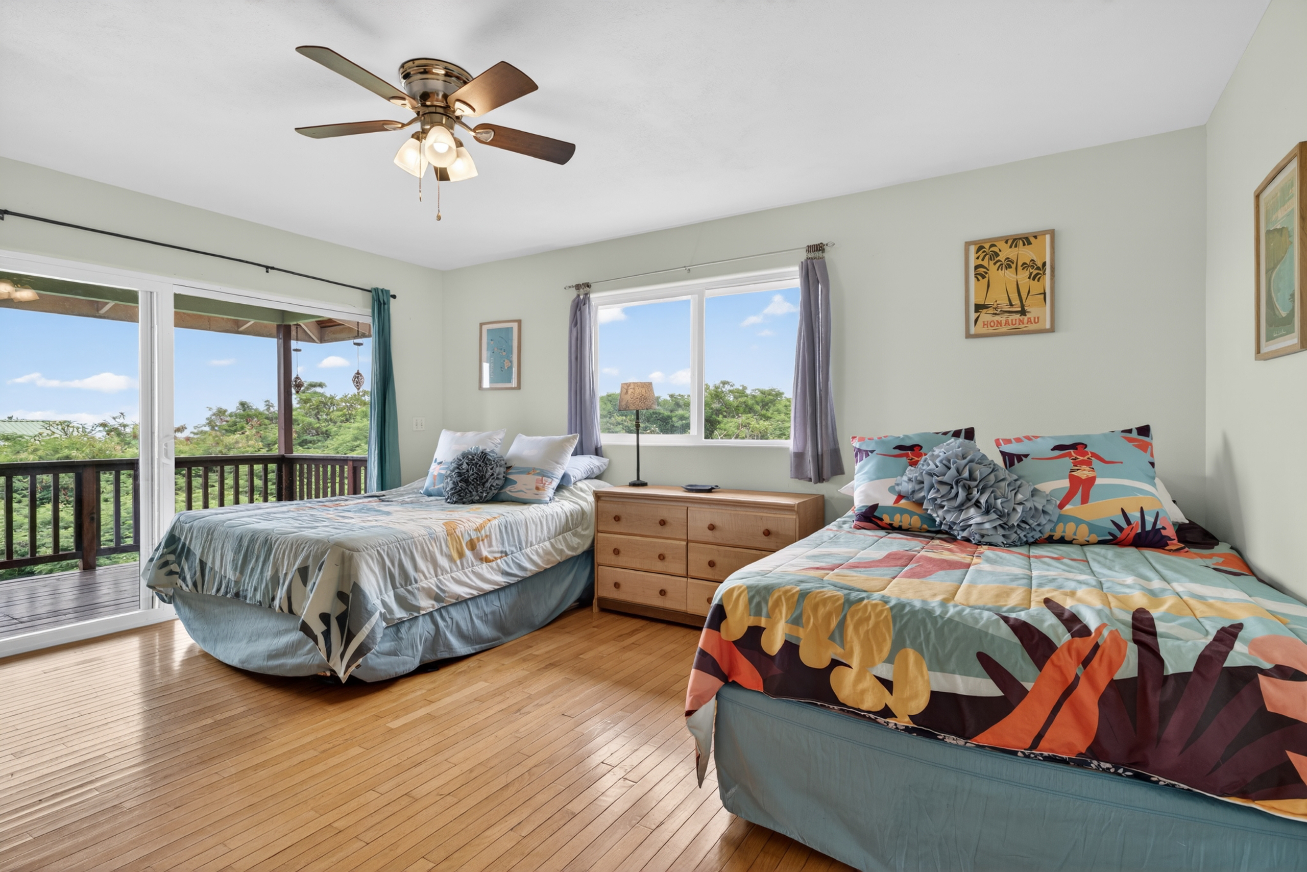 87-299 Kaohe Road Captain Cook, HI 96704 - Photo 17 of 30 a bedroom with two beds and a large window