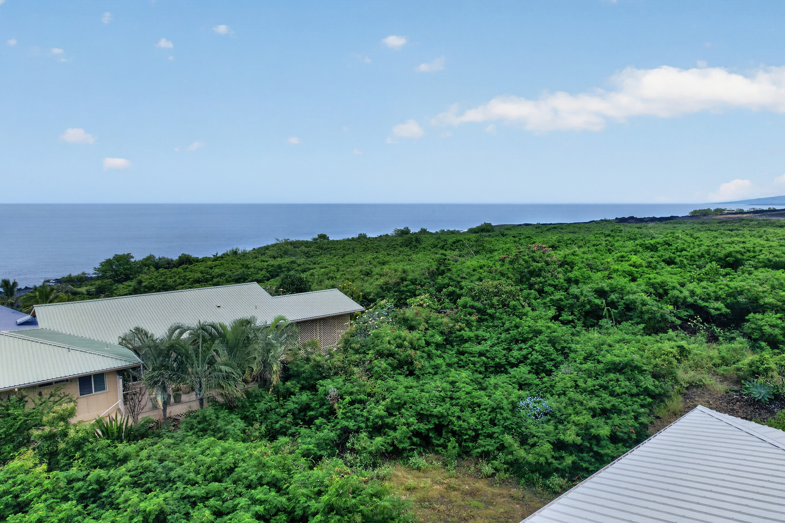 87-299 Kaohe Road Captain Cook, HI 96704 - Photo 30 of 30 an aerial view of a house with garden space and street view