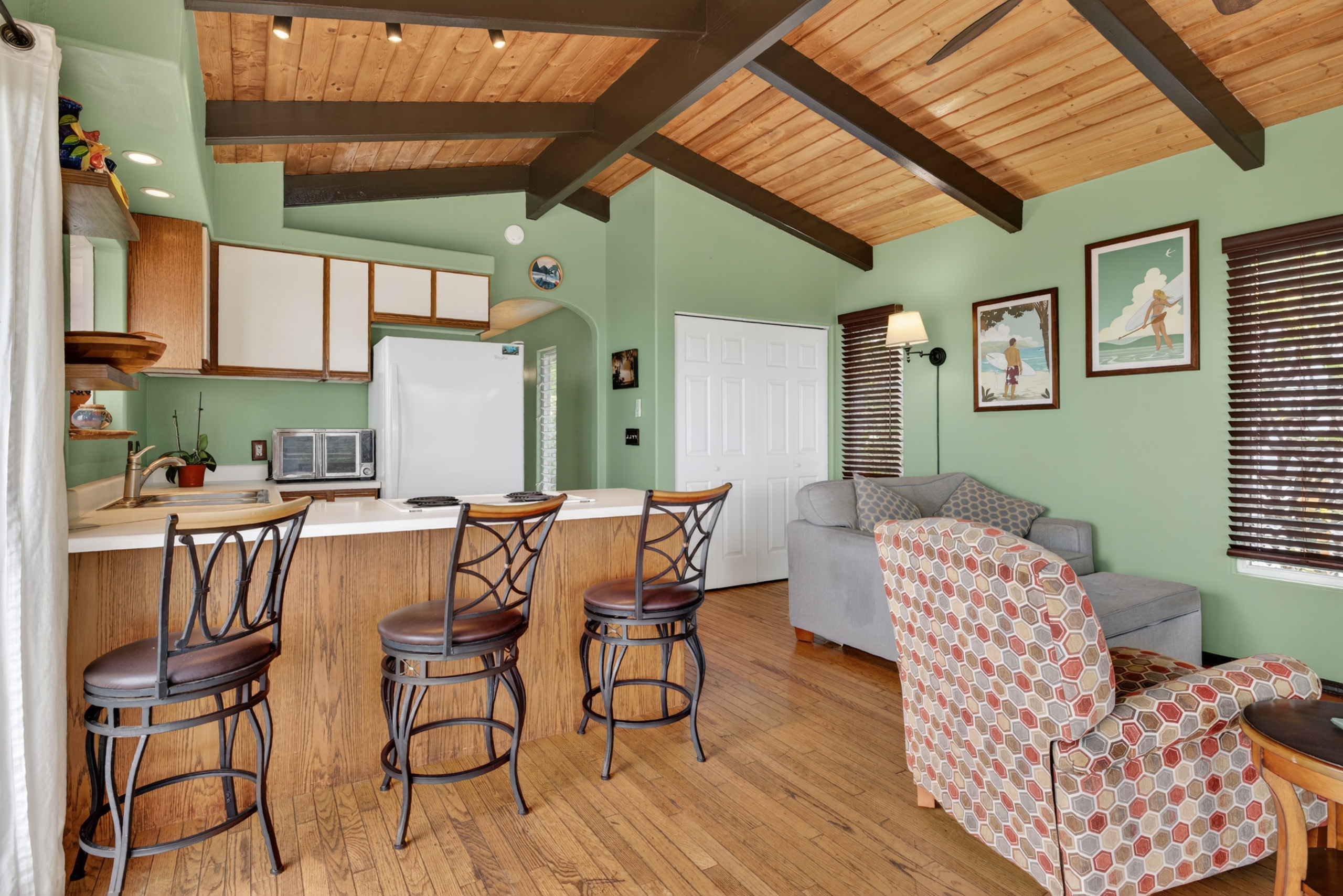87-299 Kaohe Road Captain Cook, HI 96704 - Photo 7 of 30 a dining room with furniture and wooden floor