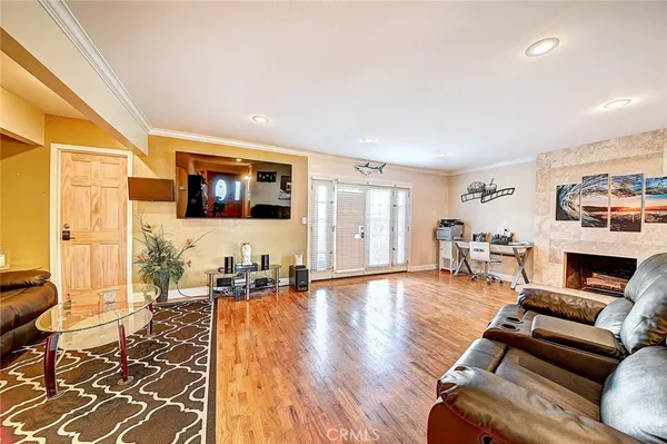 a living room with furniture and a fireplace