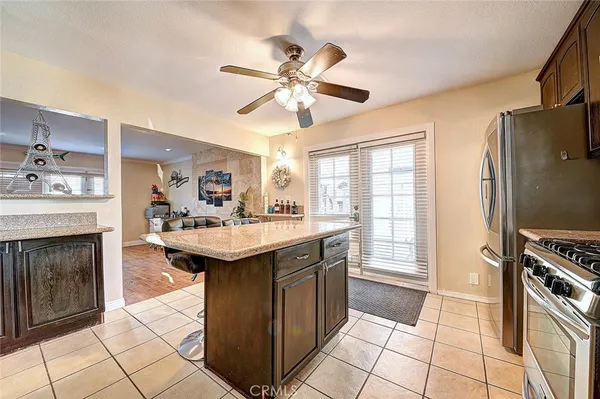 a kitchen with a sink appliances and cabinets