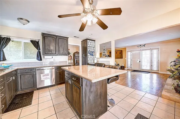 a kitchen with stainless steel appliances granite countertop a sink and a stove
