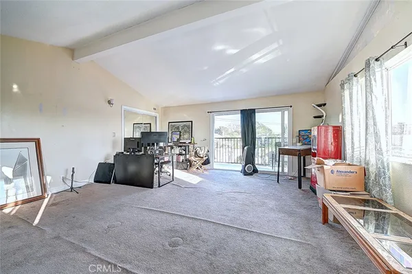 a bed room with furniture and a large window