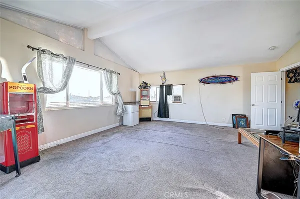 a view of a kitchen with furniture and a window