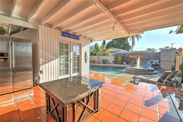 a view of a patio with a table chairs and a table