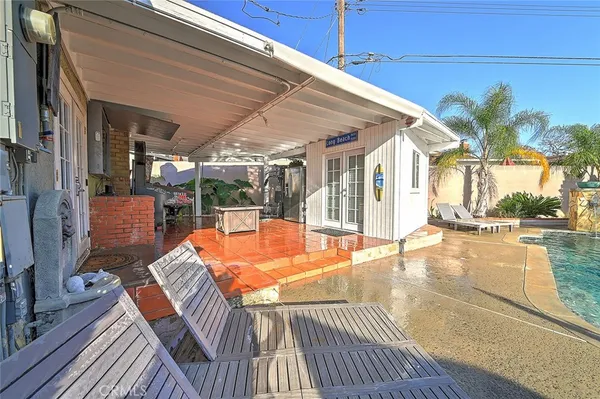 a view of swimming pool with seating area