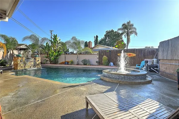 a view of a swimming pool with a patio