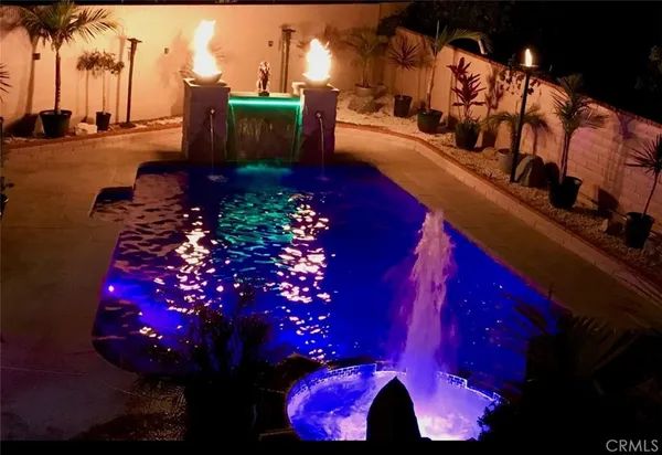 a view of swimming pool with outdoor seating