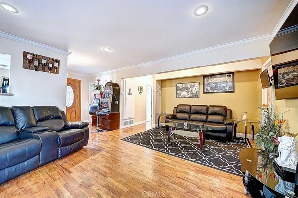 a living room with furniture and a rug