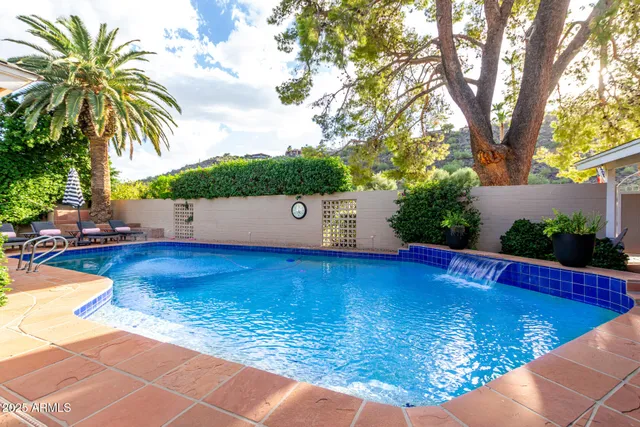 a view of a swimming pool with a chair