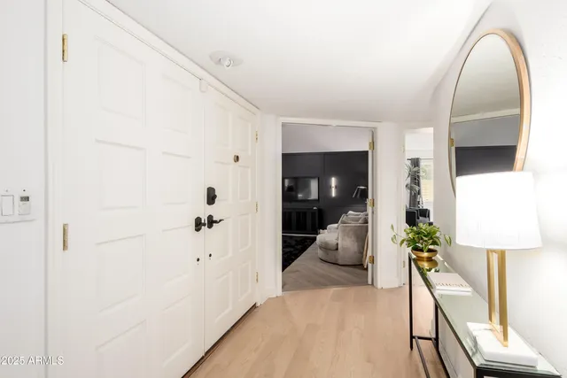 a view of a dining room with furniture wooden floor and chandelier