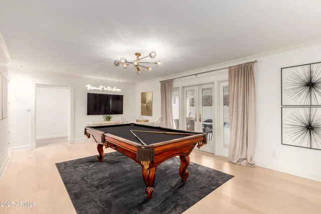 a kitchen with sink cabinets and wooden floor