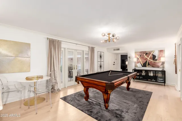a kitchen with a stove a sink and a granite counter top