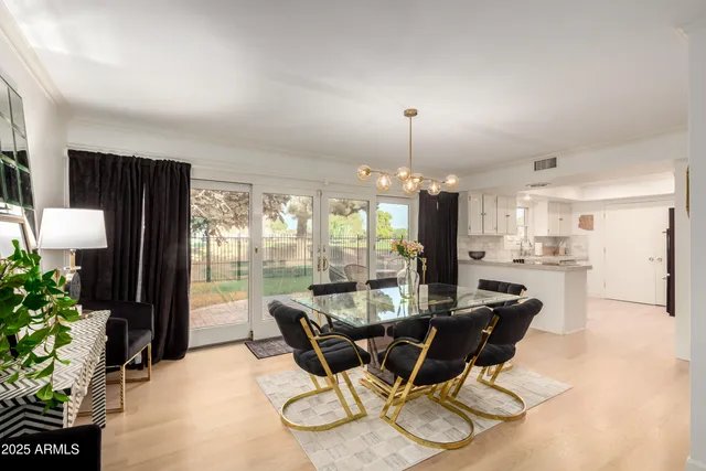a kitchen with a refrigerator and white cabinets