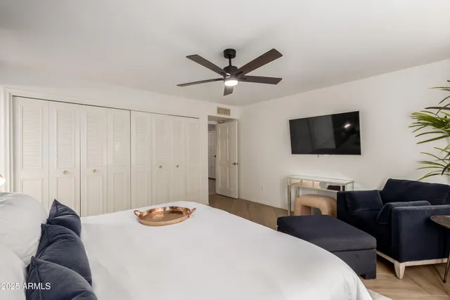 a bedroom with a bed and a window