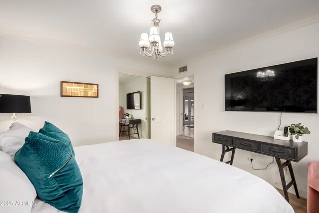 a table with a vase of flowers sitting on a table