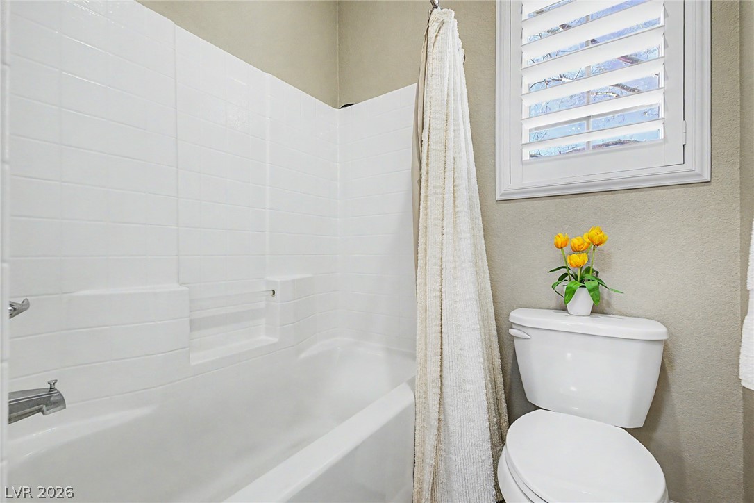 7415 Campbell Ranch Avenue Las Vegas, NV 89179 - Photo 40 of 52 A well-appointed bathroom offers privacy with plantation shutters and a clean, functional tub.