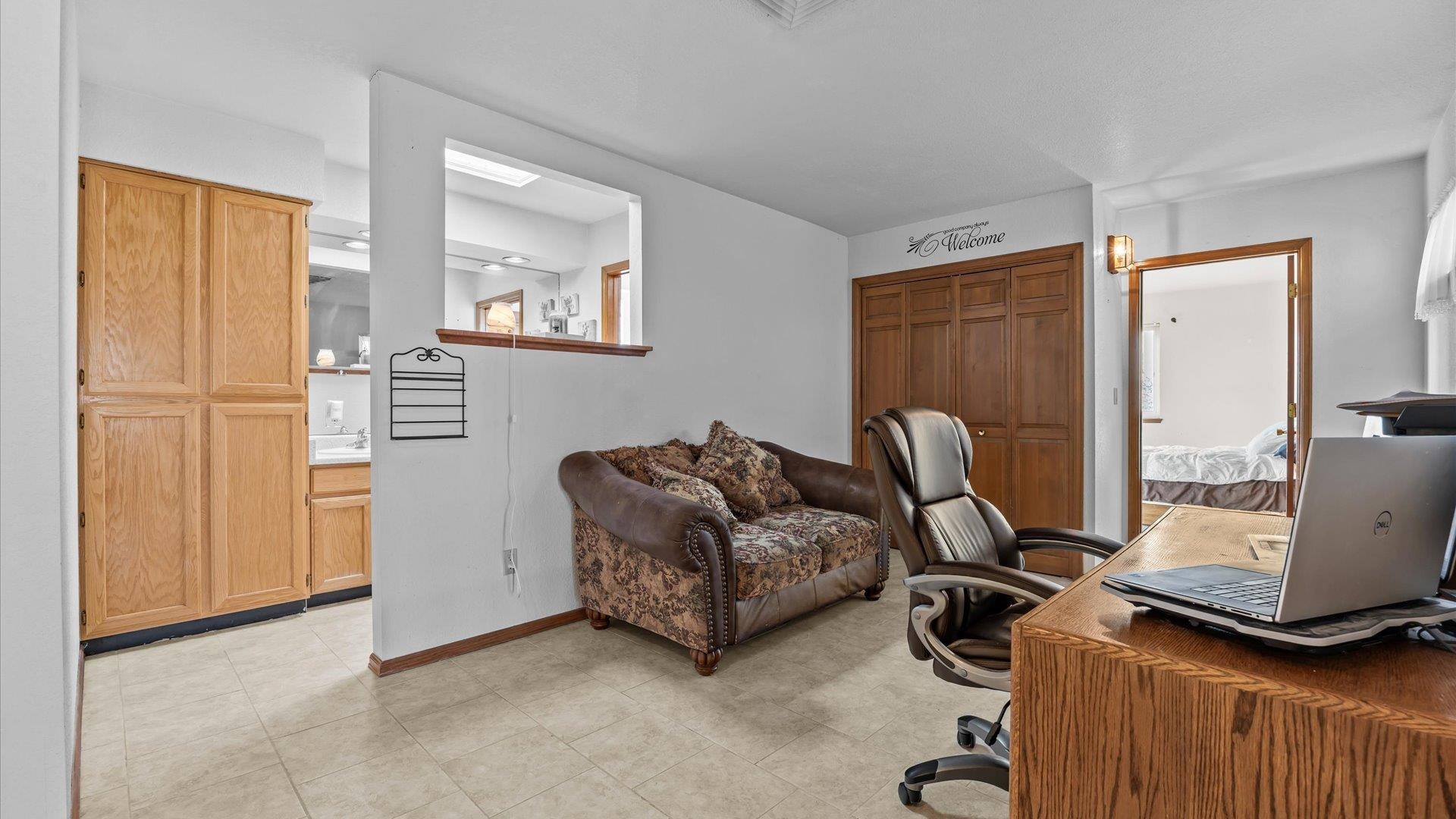 1456 17 Road Fruita, CO 81521 - Photo 16 of 42 a living room with furniture and a window