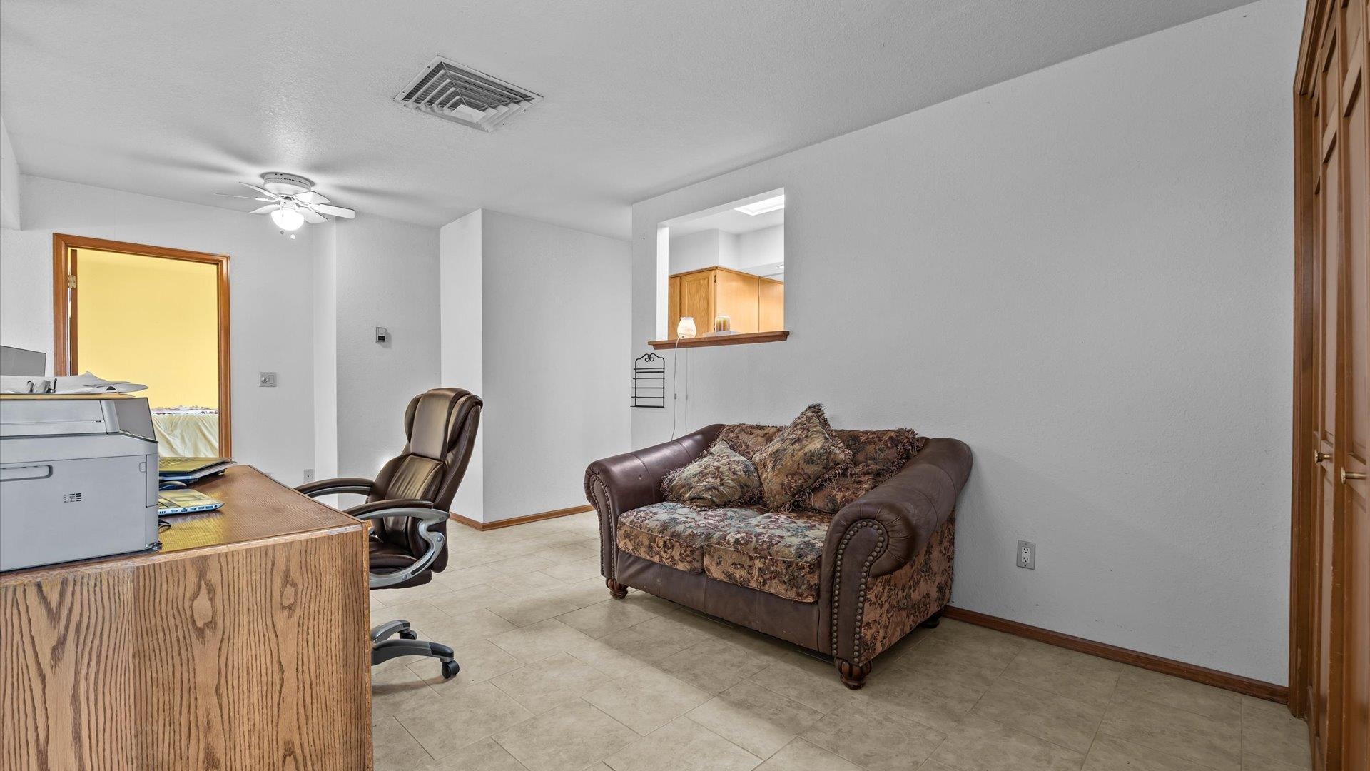 1456 17 Road Fruita, CO 81521 - Photo 17 of 42 a living room with furniture and a window