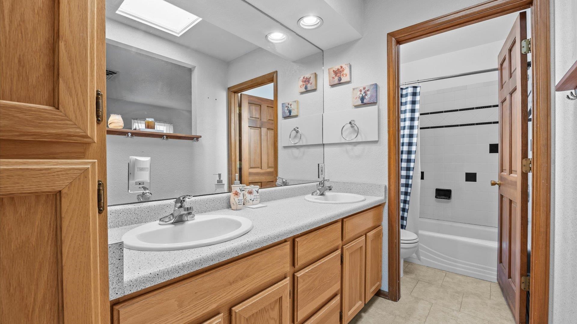 1456 17 Road Fruita, CO 81521 - Photo 18 of 42 a bathroom with a sink double vanity and a mirror