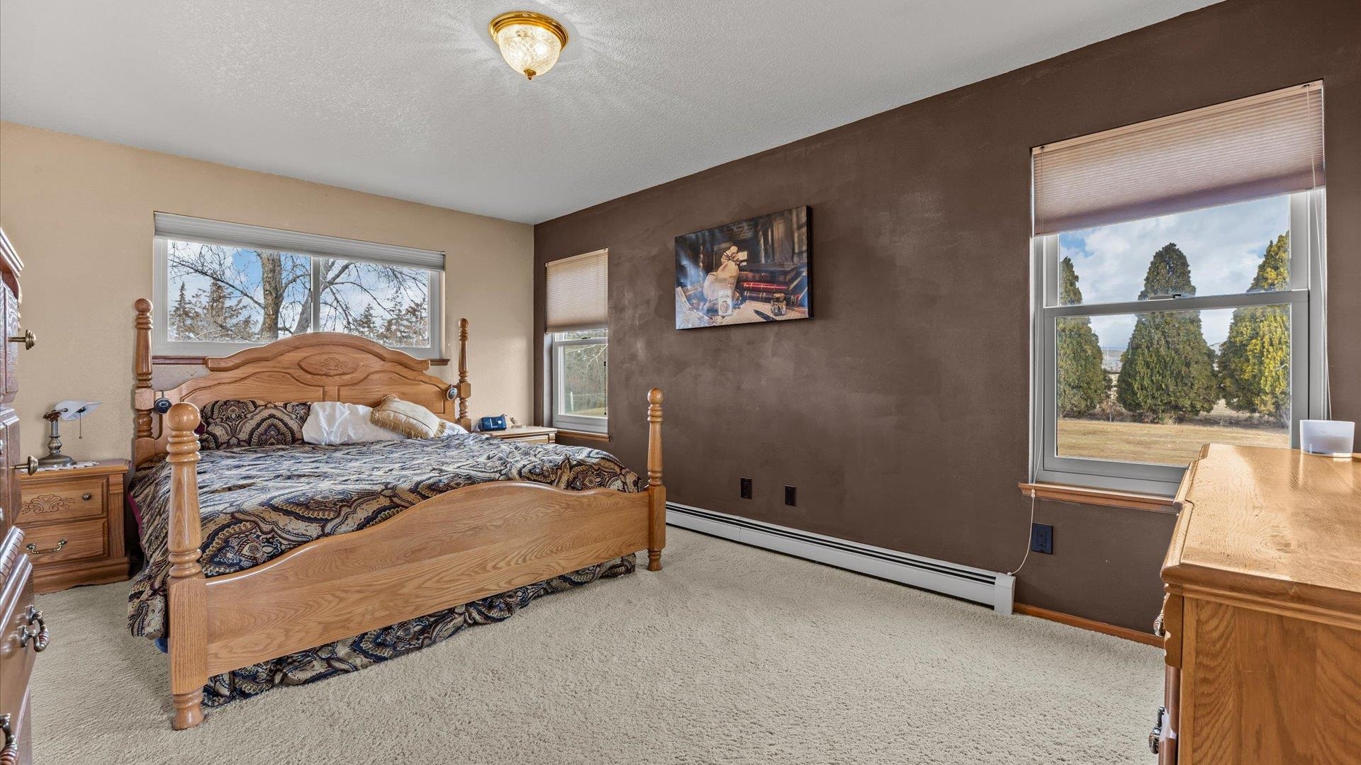 1456 17 Road Fruita, CO 81521 - Photo 19 of 42 a bedroom with a bed and a window